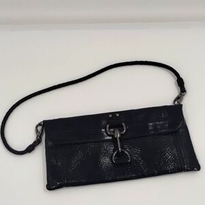 The Sak small clutch purse shiny patent leather lobster claw closure with strap
